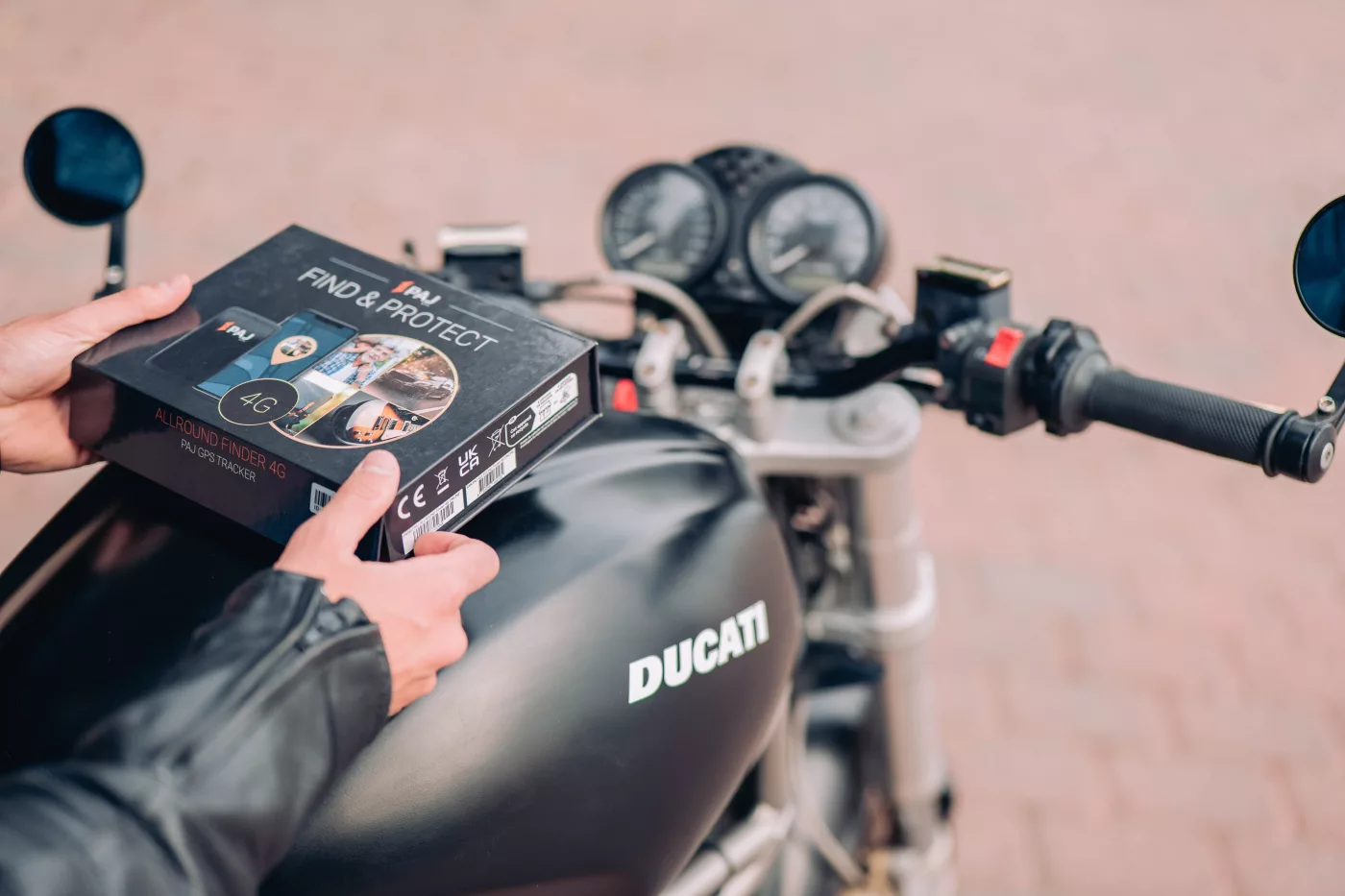 A rider on ducati motorcycle with PAJ GPS