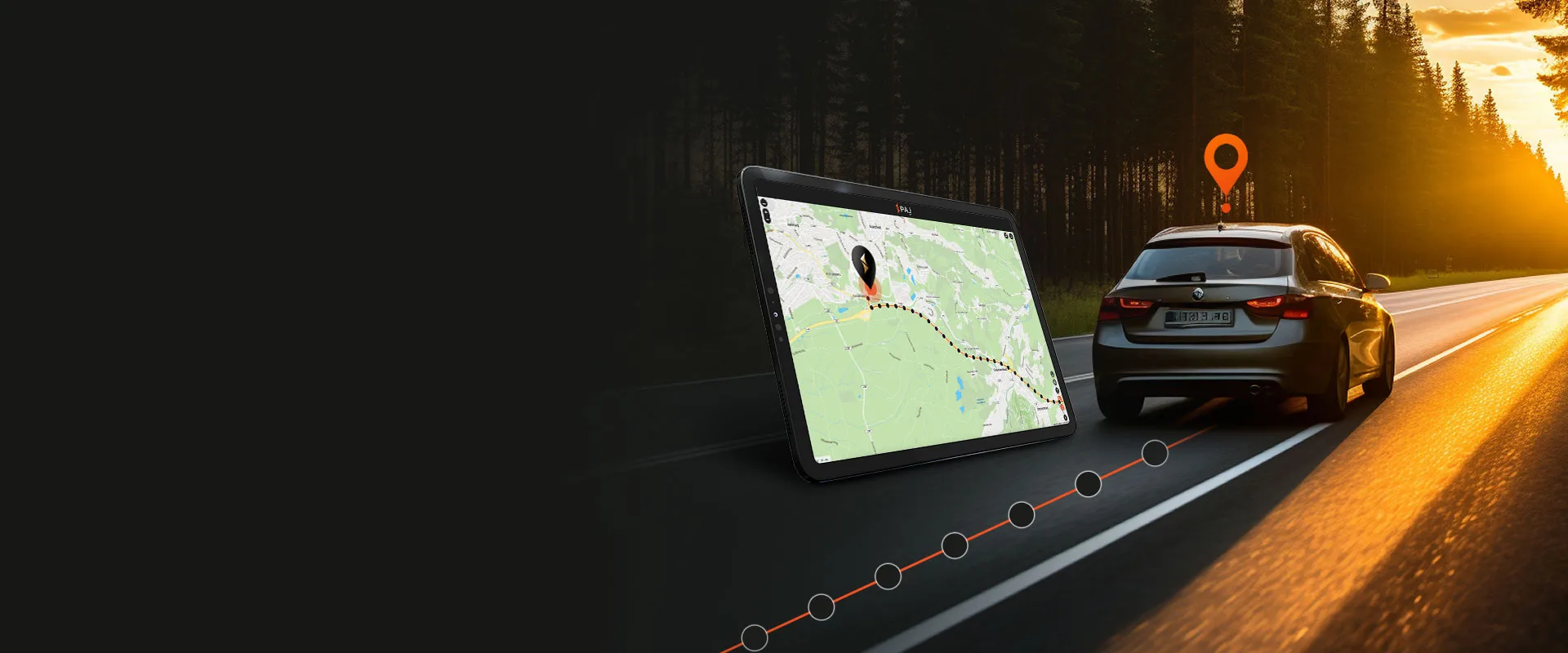 A car with Car tracker driving through a forest, a tablet following it with PAJ GPS finder application switched on.