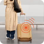 a women carrying a luggage which has luggage GPS tracker in it